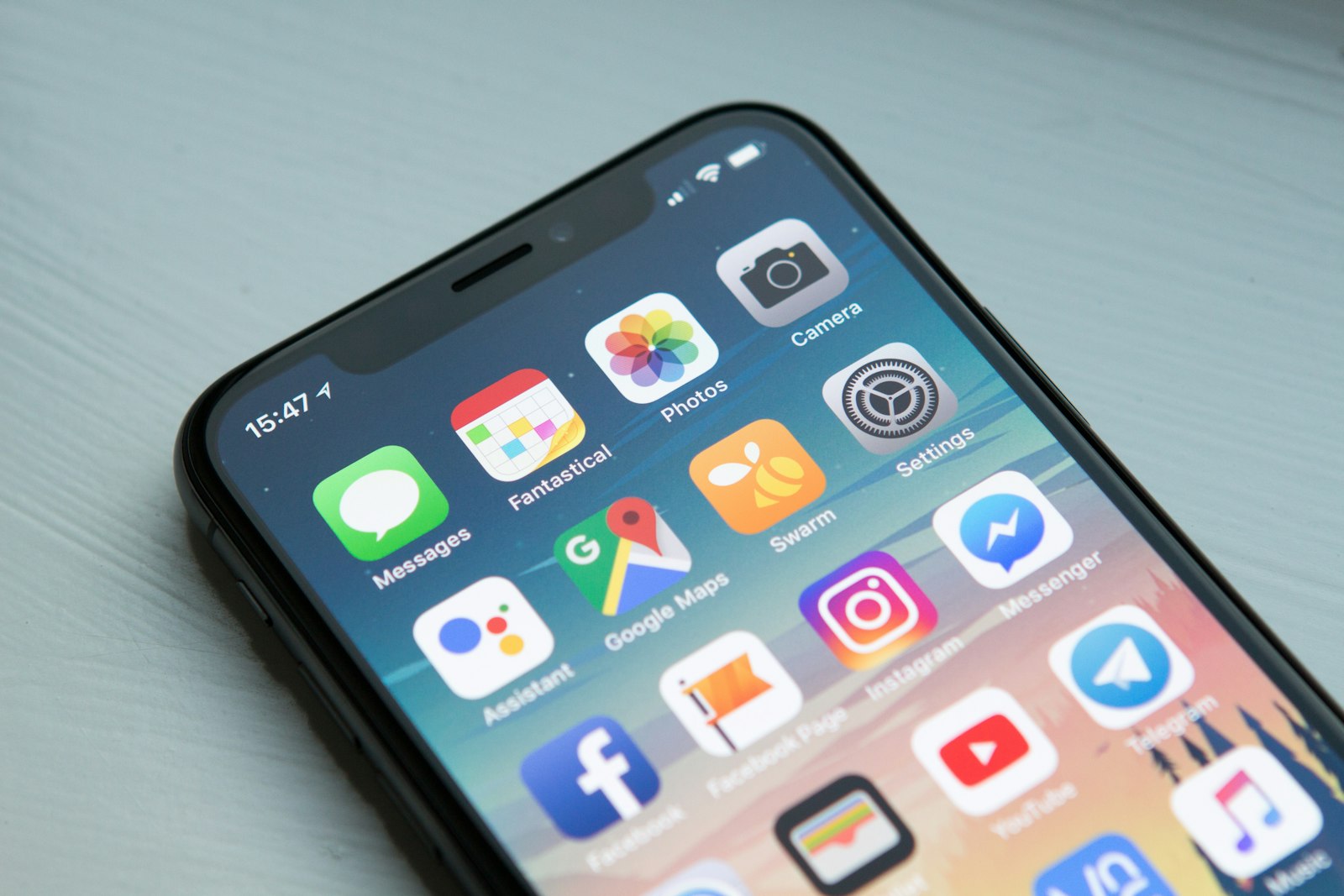 Illustrative photo: a smartphone in hand — where your travel eSIM lives