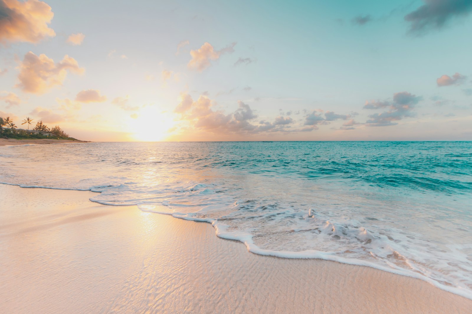 Illustrative photo: a quiet tropical beach at sunrise