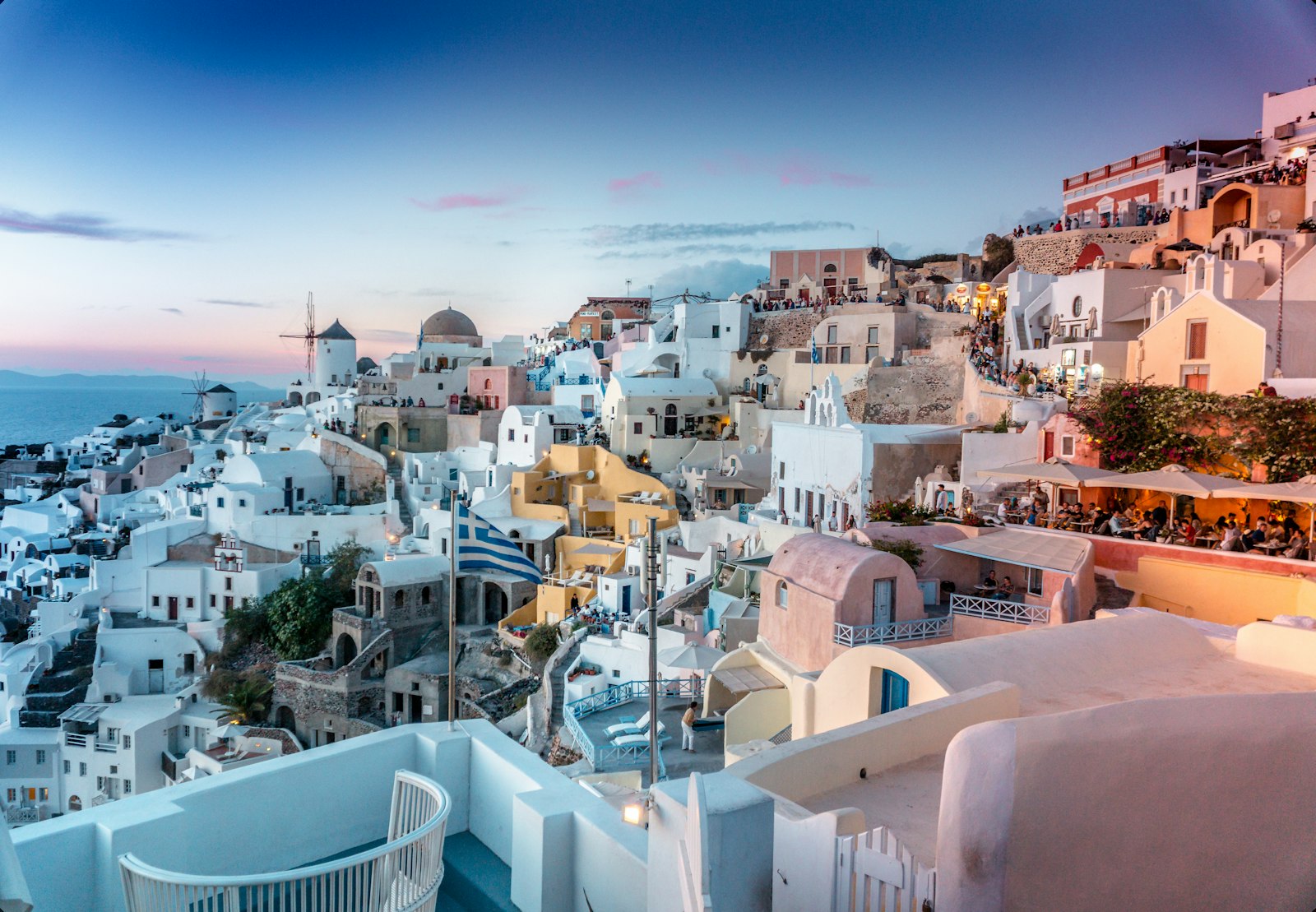 Illustrative photo: whitewashed buildings and blue domes in Santorini, Greece